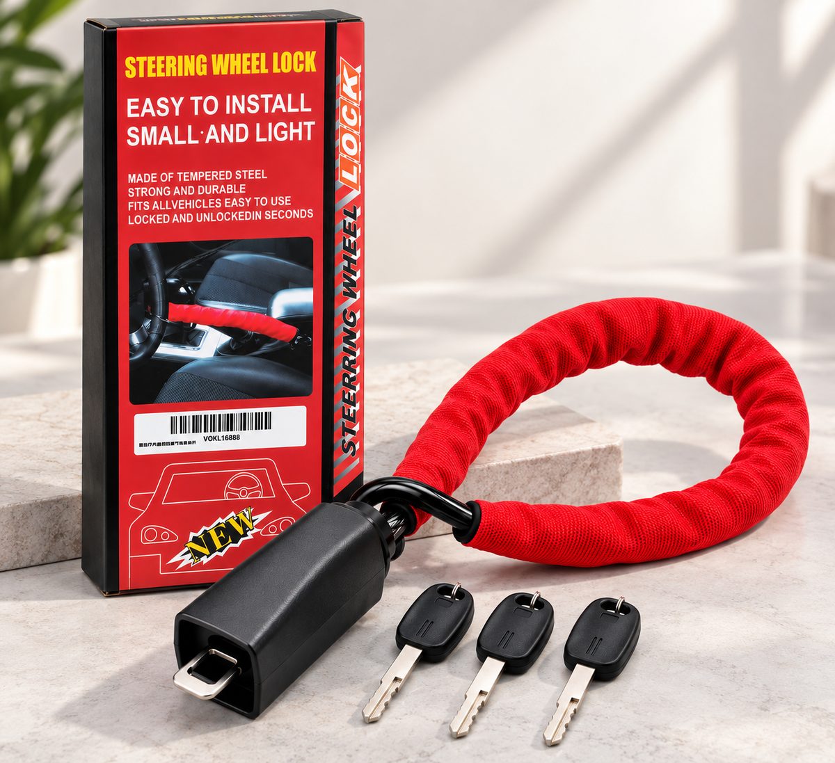 La caja de TrancaGo con la traba, el cable de acero con funda roja y las 3 llaves